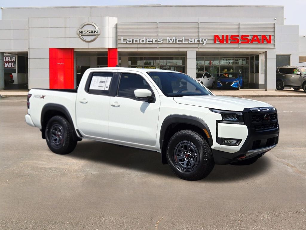 2026 Nissan Frontier PRO-X in Glacier White — front three-quarter view