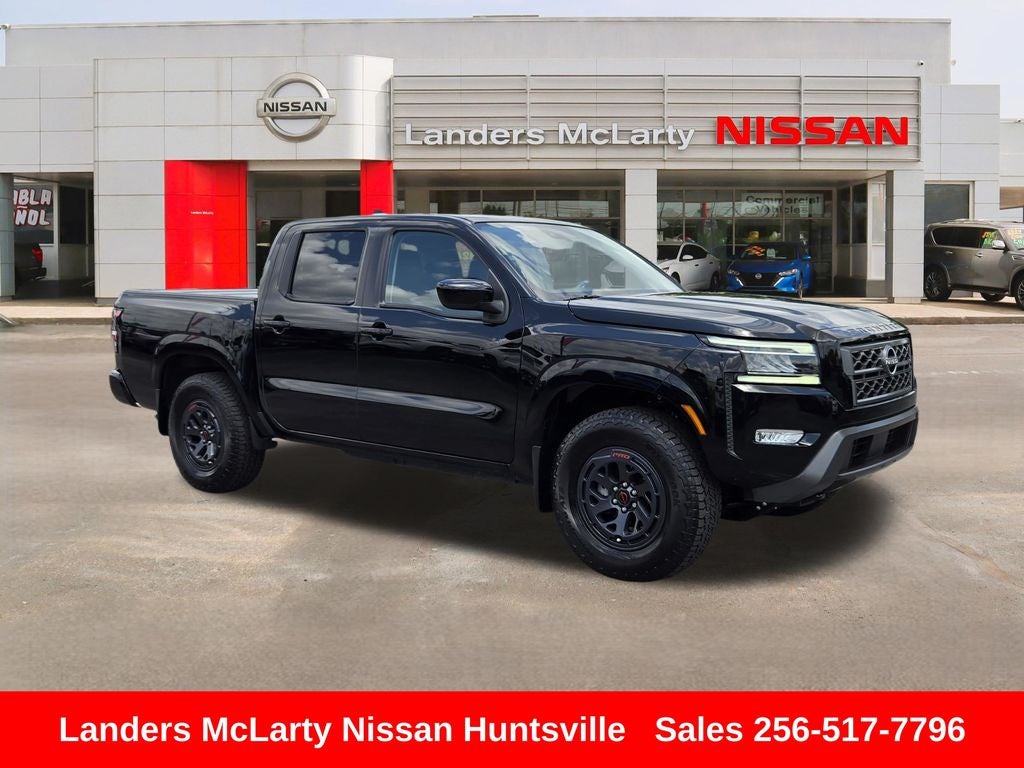 2024 Nissan Frontier SL in Super Black — front three-quarter view
