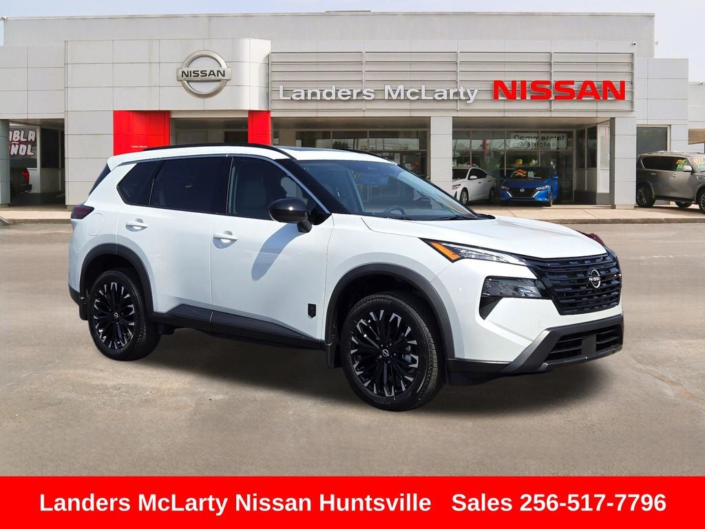 2026 Nissan Rogue Dark Armor in Everest White Pearl Tricoat — front three-quarter view