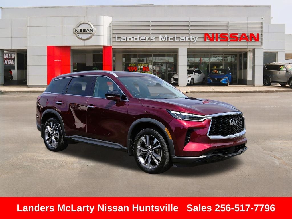 2023 INFINITI QX60 LUXE in Deep Bordeaux — front three-quarter view