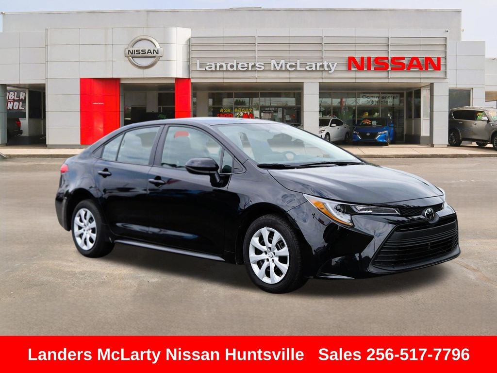 2024 Toyota Corolla LE in Midnight Black Metallic — front three-quarter view