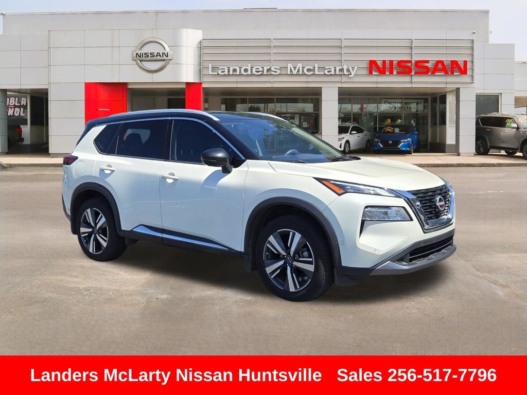 2023 Nissan Rogue SL in Pearl White Tricoat/Super Black — front three-quarter view