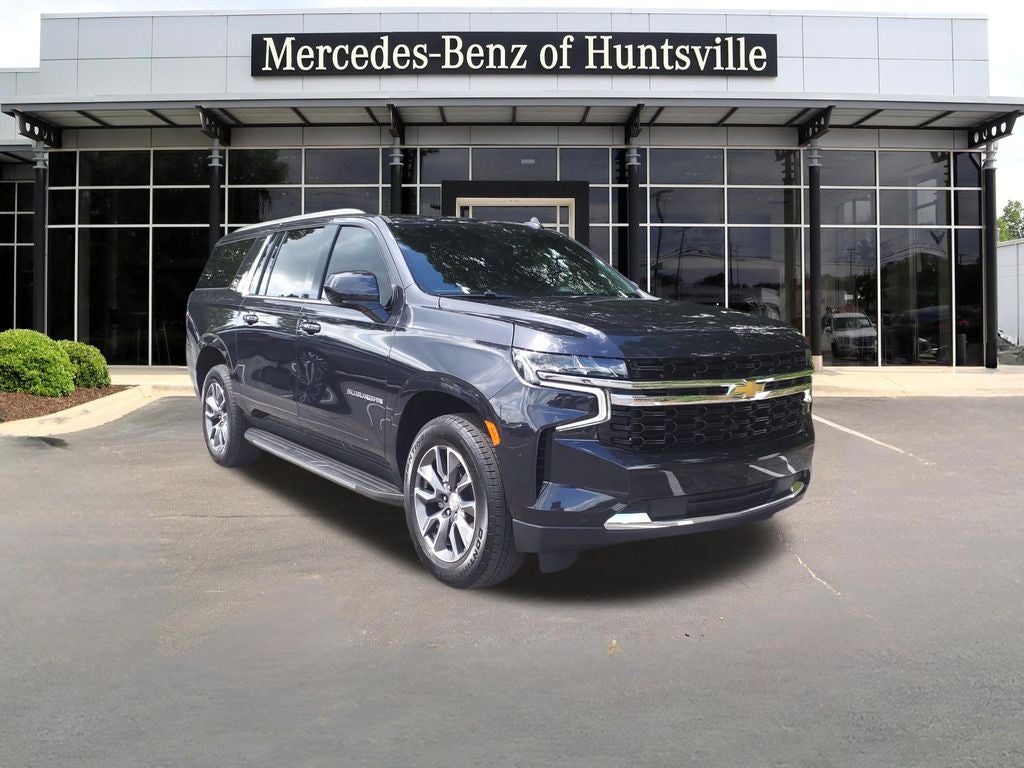 2024 Chevrolet Suburban LS in Dark Ash Metallic — front three-quarter view