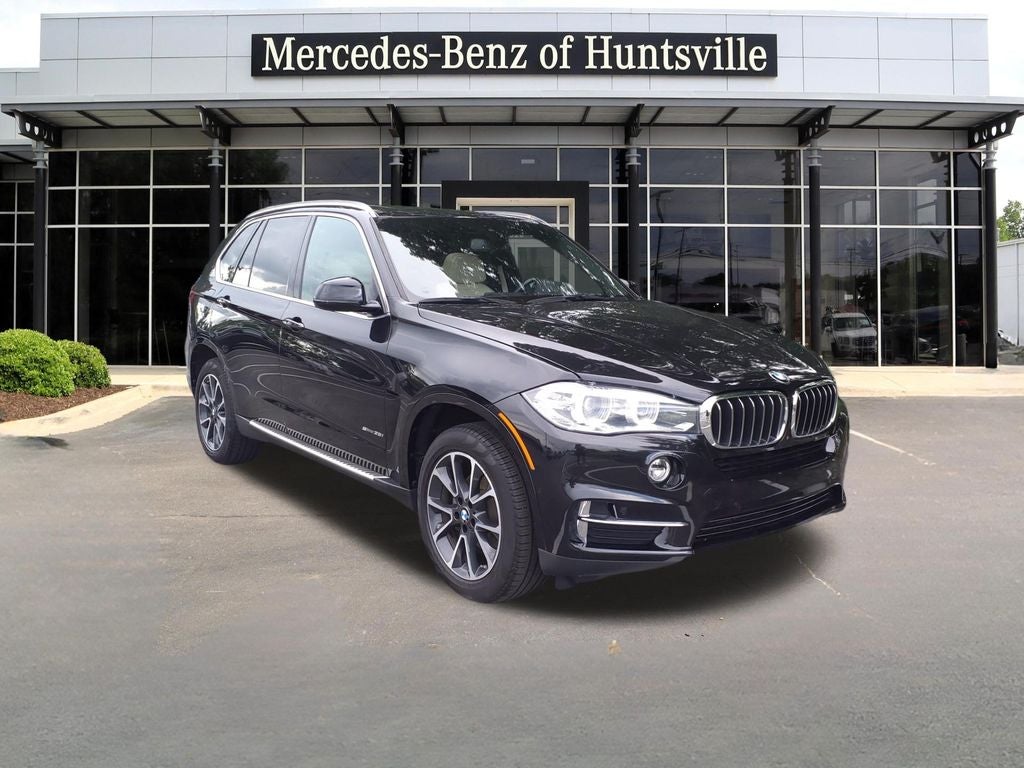 2018 BMW X5 sDrive35i in Black Sapphire Metallic — front three-quarter view